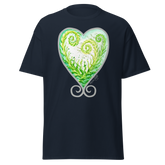 Navy blue t-shirt featuring a green and white heart design with swirls. Annie Pigott&