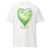 White t-shirt featuring a green and white heart design with spiral patterns. Annie Pigott&