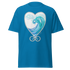 Blue t-shirt featuring a heart-shaped wave design with swirls and splashes. Annie Pigotts Portugal Wave tee
