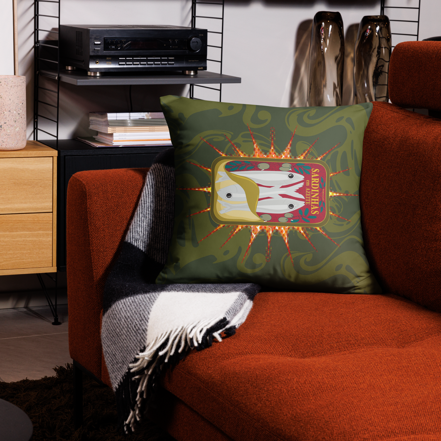Green throw pillow with sardine can design on an orange couch. Canned sardines (green) pillows