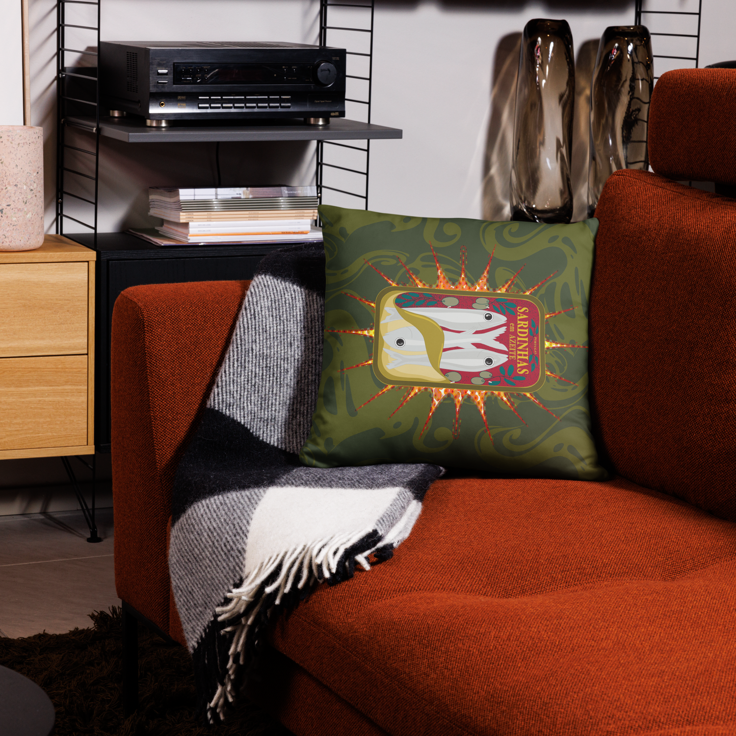 Green throw pillow with sardine can design on an orange couch. Canned sardines (green) pillows
