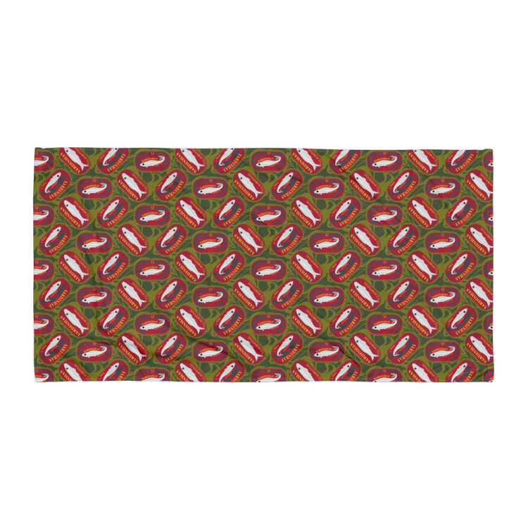 Patterned fabric featuring repeated fish illustrations on a green and red background. Sardines (Red Can) Beach Towel