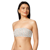 Woman wearing a floral-patterned strapless bandeau top.