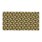 Patterned fabric featuring repeated oval designs with birds and greenery on a brown background. Sardines (Yellow Can) Beach Towel