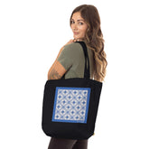 model carrying Azulejo 3D Blue Organic Tote Bag in black