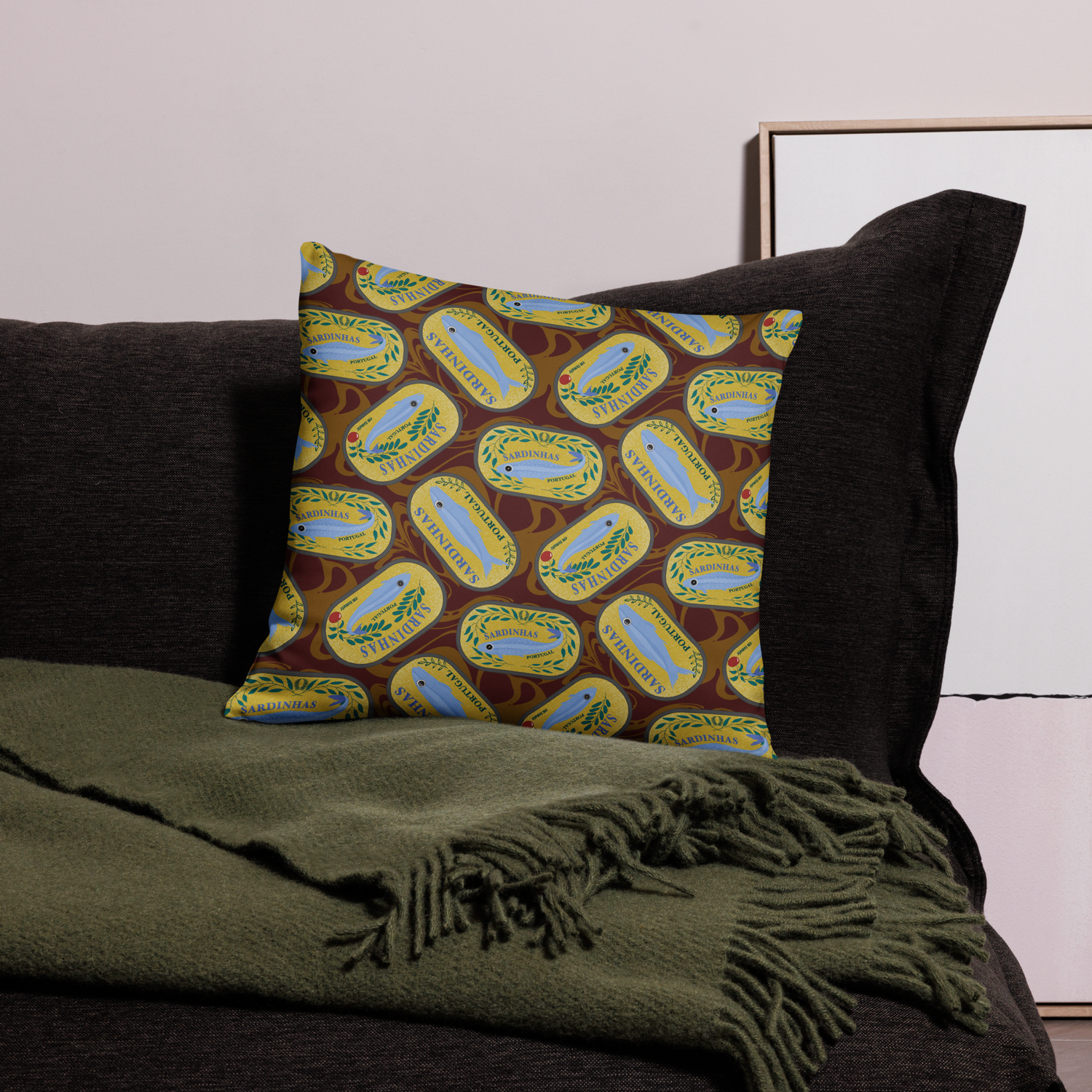 Decorative pillow with sardine can design on a dark couch. sardines (yellow can) all-over-print pillows